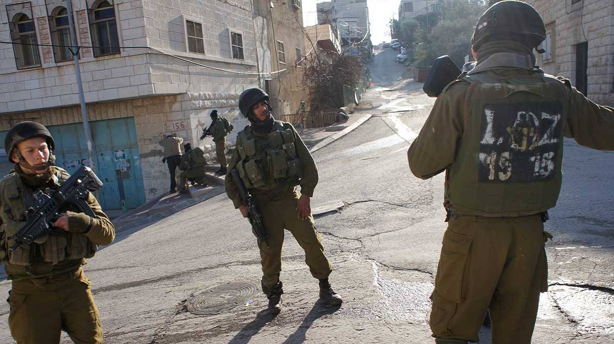 Soldiers occupy a town after the government declares martial law